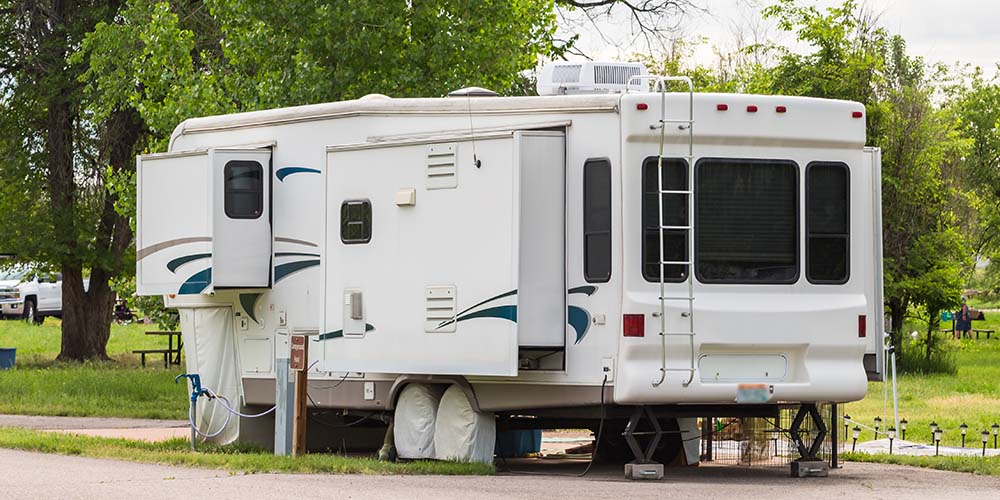 Parked motorhome at a campsite after receiving rv inspection services